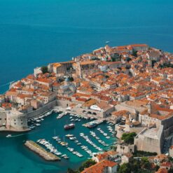 Explore Dubrovnik's stunning coastal view showcasing its historic architecture and vibrant sea.